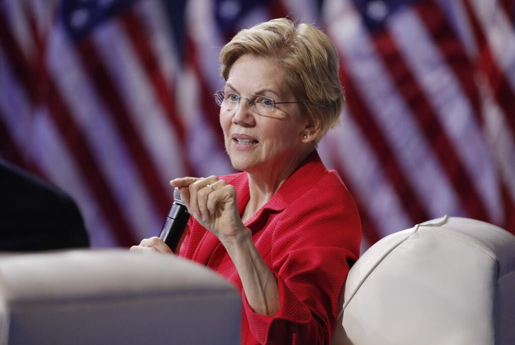 FILE - In this Oct. 2, 2019 file photo, Democratic presidential candidate Sen. Elizabeth Warren, D-Mass., speaks during a gun safety forum in Las Vegas. Bernie Sanders and Elizabeth Warren raked in more cash over the past three months than any of their Democratic rivals. (AP Photo/John Locher)