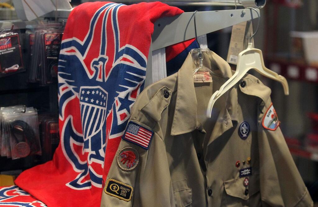 The Boy Scout logo and a uniform are displayed in a store at the Marin Council of the Boy Scouts of America on July 27, 2015 in San Rafael, Calif. There are more than 12,200 reported victims of sexual abuse in the youth organization over the years. (Justin Sullivan/Getty Images/TNS)