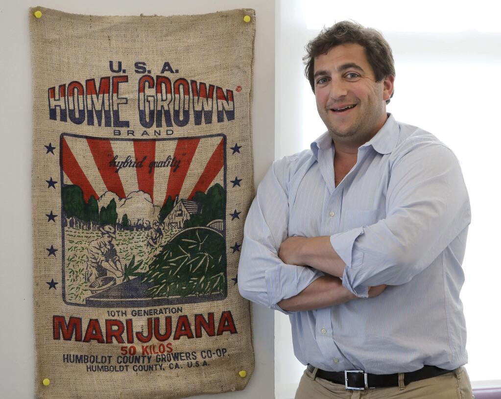 In this Wednesday, July 11, 2018, photo, Ben Kovler, CEO, Green Thumb Industries poses for a portrait at the company's office in Chicago. Green Thumb Industries had a business plan, expertise and plenty of ambition, but didn't have access to enough capital to grow its marijuana business. Last month, the company with $20 million in revenue from pot shops in seven states turned its gaze north and went public in Canada, where marijuana soon will be broadly legalized nationwide. (AP Photo/Charles Rex Arbogast)
