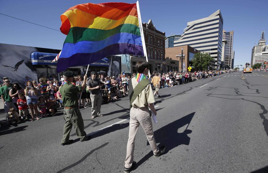 A group of Boy Scouts march during the Salt Lake City's annual gay pride parade Sunday, June 8, 2014, in Salt Lake City. (AP Photo/Rick Bowmer)