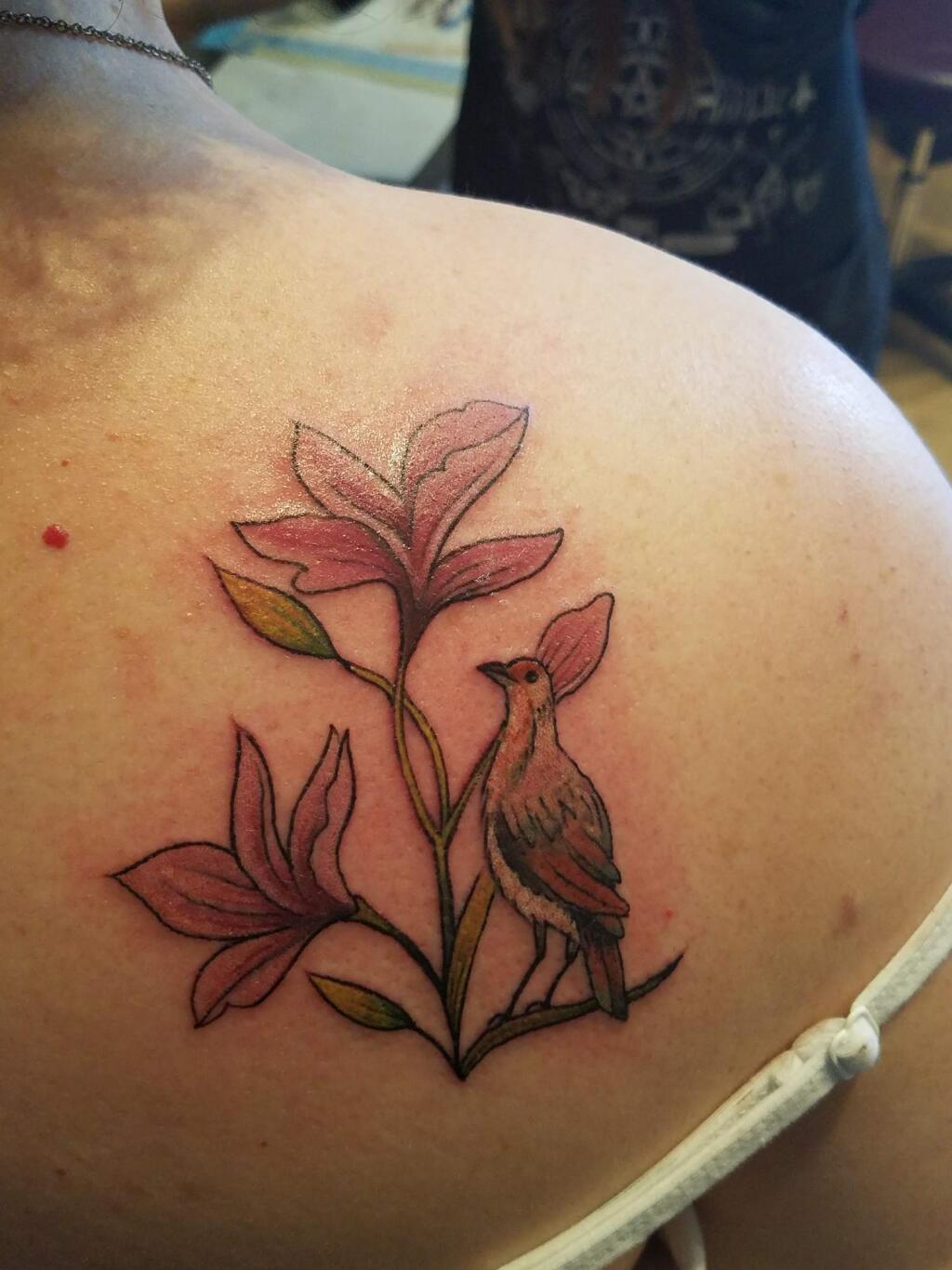 Diana Butler of Santa Rosa worked with Jen at Valkyrie Tattoo in Penngrove for this tattoo, a representation of her grandfathers. ' I really wanted to include both of my grandfathers in walking me down the aisle on my wedding day. Unfortunately, I lost one to cancer before that could happen,' she wrote. 'The plumeria for one, from Nicaragua. The Rufous hornero bird for the other, from Argentina.' (Diana Butler)