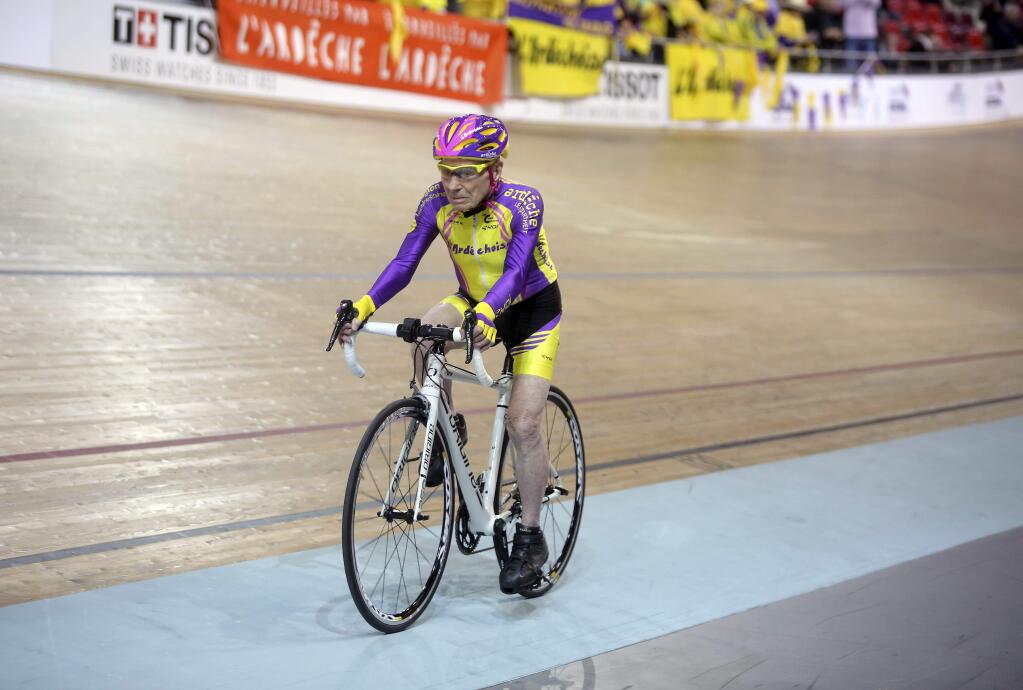 French cyclist Robert Marchand, 105, pedals in a bid to beat his record for distance cycled in one hour, at the velodrome of Saint-Quentin en Yvelines, outside Paris, Wednesday, Jan. 4, 2017. (AP Photo/Thibault Camus)