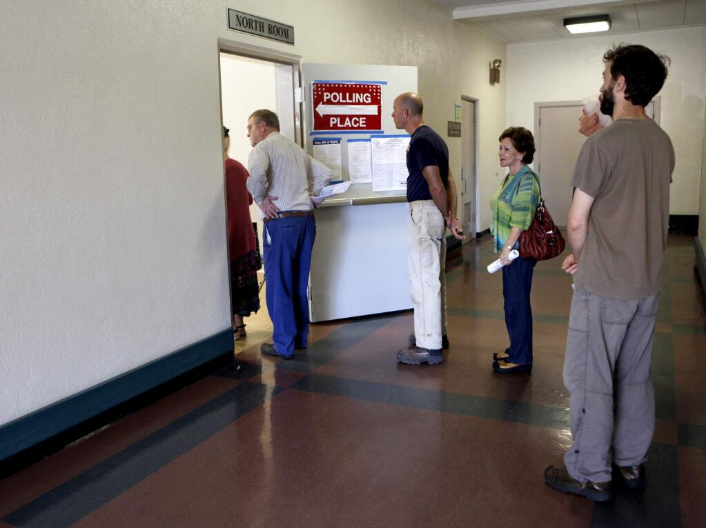 People stand in line to vote at the Santa Rosa Veterans Memorial Building in Santa Rosa in 2012. (BETH SCHLANKER/ PD FILE)