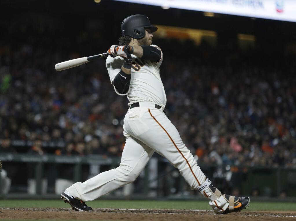 San Francisco Giants' Brandon Crawford swings for an RBI single off Los Angeles Dodgers' Brandon McCarthy in the fourth inning of a baseball game Monday, May 15, 2017, in San Francisco. (AP Photo/Ben Margot)
