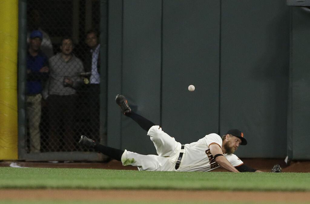 San Francisco Giants right fielder Hunter Pence cannot catch a three-run triple by the Kansas City Royals' Whit Merrifield during the sixth inning Tuesday, June 13, 2017. (AP Photo/Jeff Chiu)