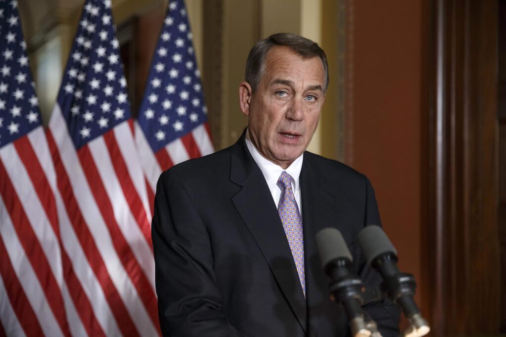 House Speaker John Boehner of Ohio responds to President Barack Obama's intention to spare millions of illegal immigrants from being deported, a use of executive powers that is setting up a fight with Republicans in Congress over the limits of presidential powers, Friday, Nov. 21, 2014, during a news conference on Capitol Hill in Washington. Boehner, who has refused to have his members vote on broad immigration legislation passed by the Senate last year, said earlier that Obama's decision to go it alone 'cemented his legacy of lawlessness and squandered what little credibility he had left.' (AP Photo/J. Scott Applewhite)