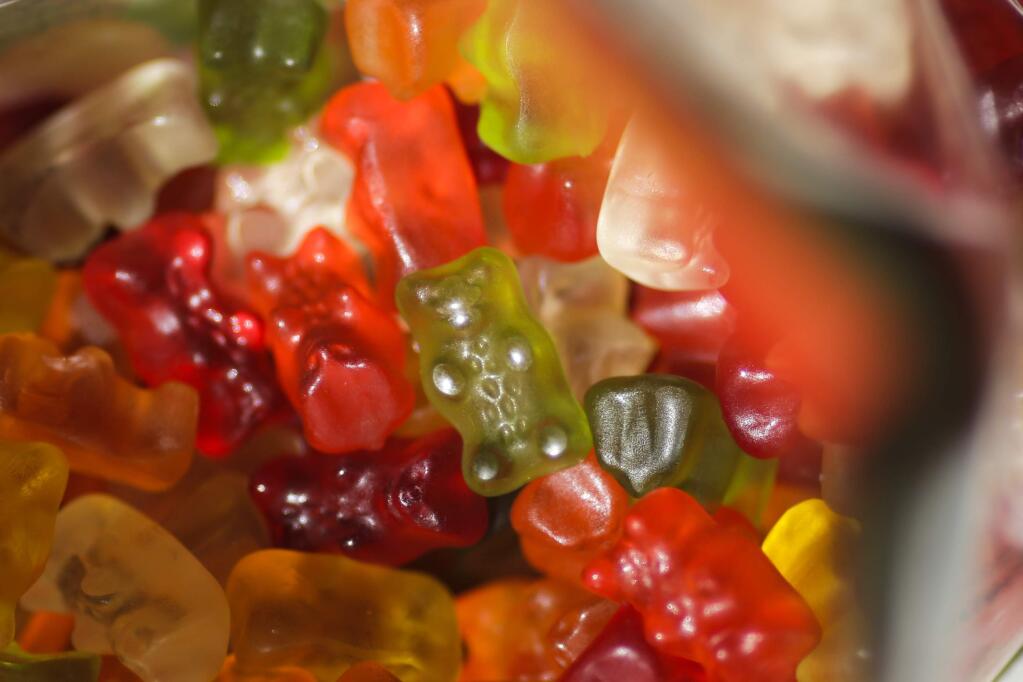 Haribo gummy bears sit in their package in Berlin, Germany, Friday, 24, 2017. Germany's iconic gummy bear will soon be 'Made in USA.' Bonn-based Haribo, which invented the gummy bear nearly a century ago, said Friday it would open a U.S. factory in Wisconsin in 2020. (AP Photo/Markus Schreiber)