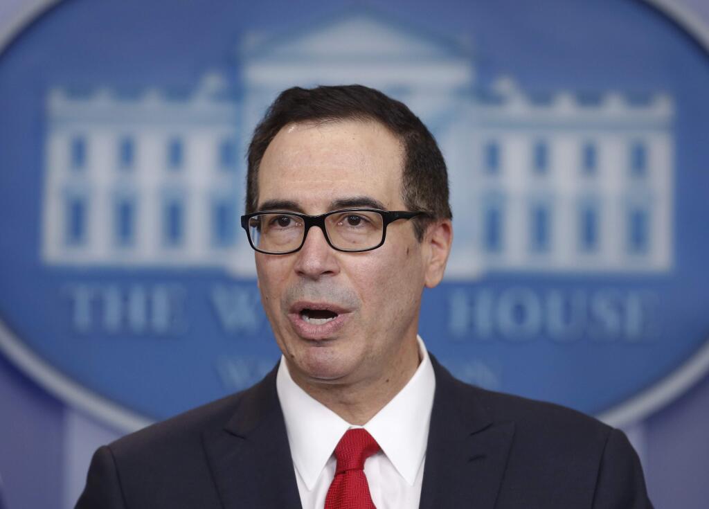 Treasury Secretary Steven Mnuchin speaks in the briefing room of the White House in Washington, Wednesday, April 26, 2017. President Donald Trump is proposing dramatically reducing the taxes paid by corporations big and small in an overhaul his administration says will spur economic growth and bring jobs and prosperity to the middle class. (AP Photo/Carolyn Kaster)