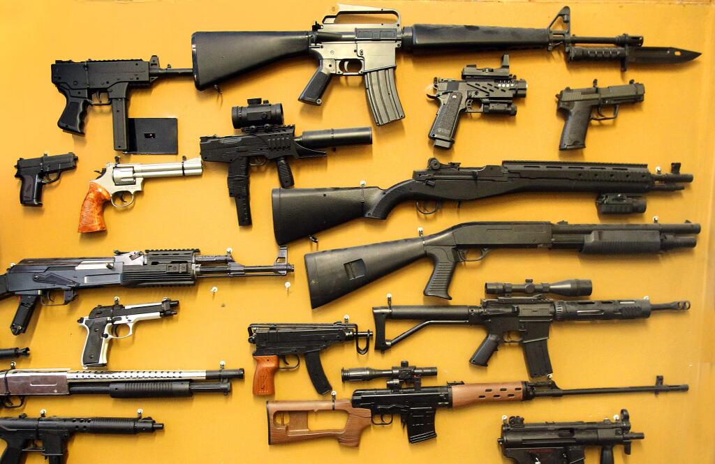 A collection of replica airsoft guns is displayed at Playland in Cotati in 2013. (JOHN BURGESS/ PD FILE)