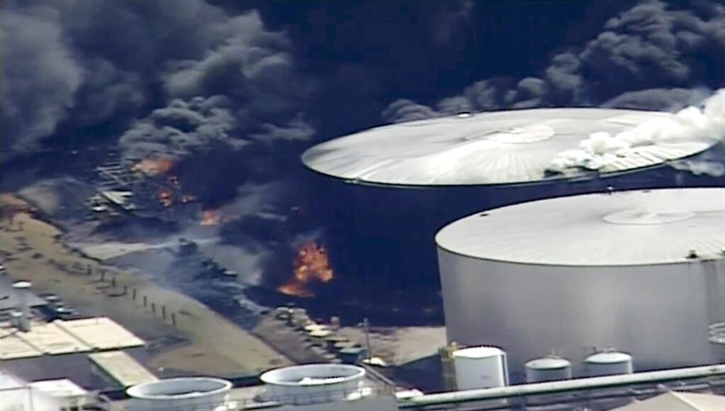 This aerial image from video provided by KSTP-TV in Minneapolis, shows smoke rising from the Husky Energy oil refinery after an explosion Thursday, April 26, 2018, at the plant in Superior, Wis. Authorities say several people were injured in the explosion. (KSTP-TV via AP)