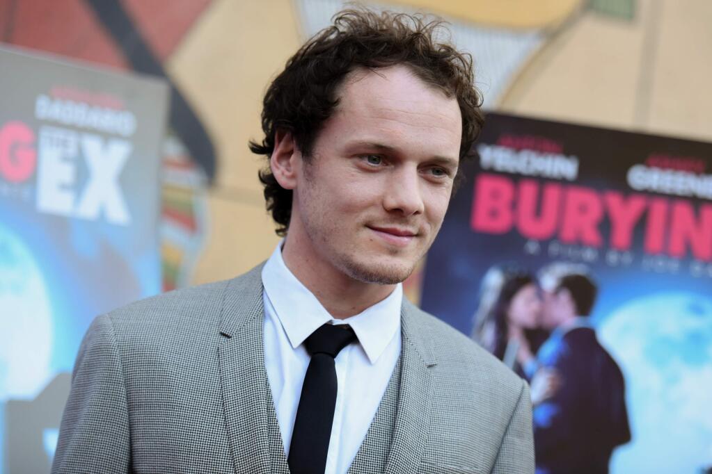 FILE - In this June 11, 2015, file photo, Anton Yelchin arrives at a special screening of 'Burying the Ex' held at Grauman's Egyptian Theatre in Los Angeles. Yelchin, a charismatic and rising actor best known for playing Chekov in the new 'Star Trek' films, has died at the age of 27. He was killed in a fatal traffic collision early Sunday morning, June 19, 2016, his publicist confirmed. (Photo by Richard Shotwell/Invision/AP, File)