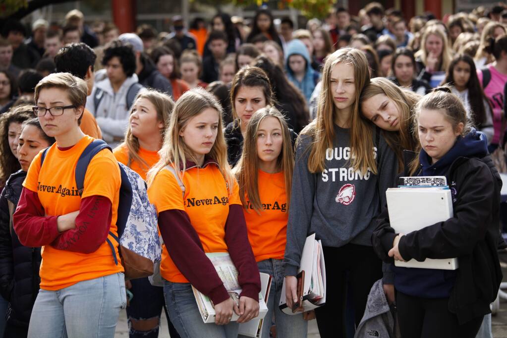 Petaluma High School students participate in a walkout on Wednesday, March 14, 2018 to show support and unity to the students of Marjory Stoneman Douglas High in Florida where a young gunman killed 17 people. The students held a moment of silence for 17 minutes in honor of them. The hope is to change gun regulations. (CRISSY PASCUAL/ARGUS-COURIER STAFF)