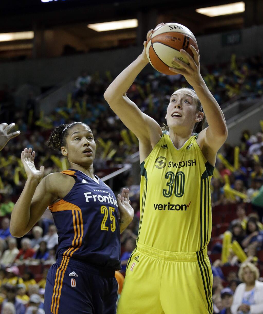 FILE - In this July 12, 2017, file photo, Seattle Storm's Breanna Stewart (30) shoots as Connecticut Sun's Alyssa Thomas backs away in the first half of a WNBA basketball game, in Seattle. Breanna Stewart can now compete against other WNBA players in a video game. Her teammates will be featured in a video game for the first time this fall. (AP Photo/Elaine Thompson, File)