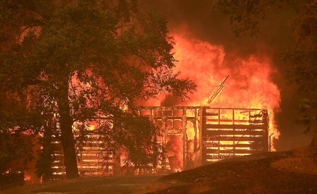 Flames spread into Scotts Valley as a barn burns on Tuesday, July 31, 2018. (KENT PORTER/ PD)