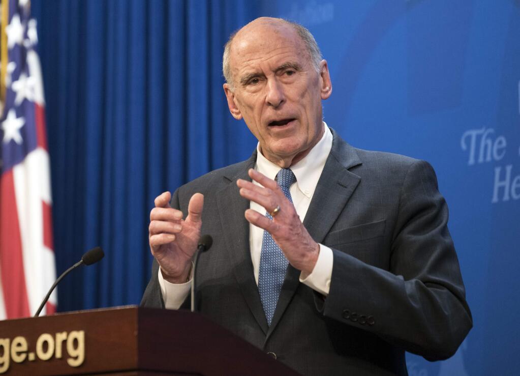 FILE - In this Oct. 13, 2017, file photo, Director of National Intelligence Dan Coats speaks at a Heritage Foundation event in Washington. Coats' drumbeat of criticism against Russia is clashing loudly with President Donald Trump's pro-Kremlin remarks, leaving the soft-spoken spy chief in an uncomfortable _ and perhaps perilous _ seat in the administration. (AP Photo/Kevin Wolf, File)