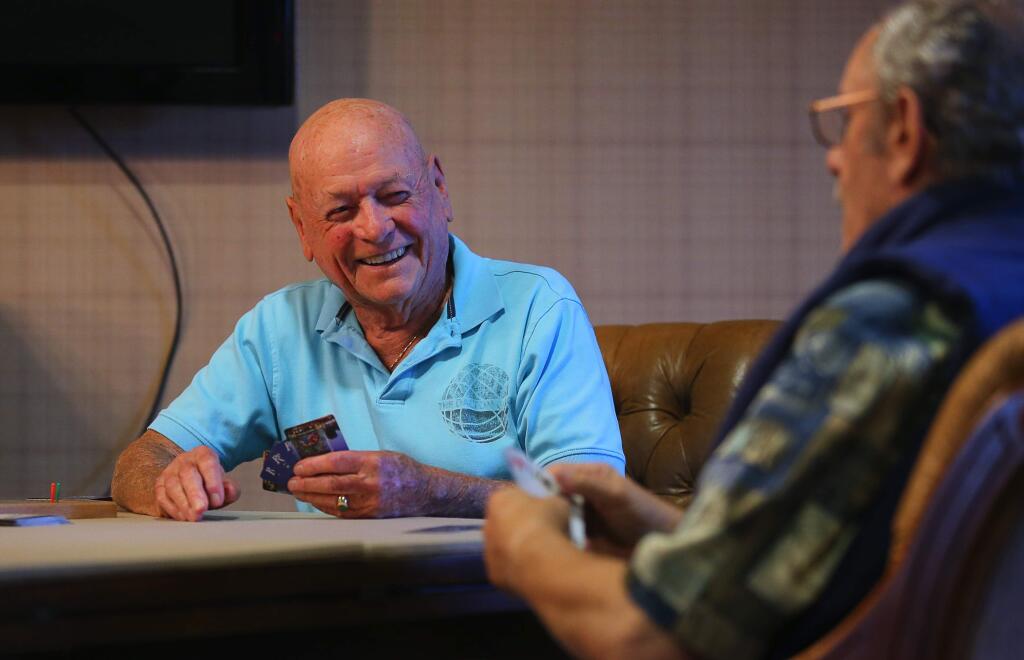 Roy Evans, left, and Bob Miller play cribbage at Varenna at Fountainfrove, in Santa Rosa, on Monday, August 15, 2016. (Christopher Chung/ The Press Democrat)
