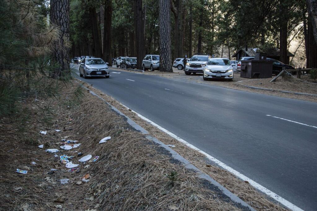 A road lined with trash in Yosemite National Park. Human feces, overflowing garbage, illegal off-roading and other damaging behavior in fragile areas are beginning to overwhelm some of the West's iconic national parks as a partial government shutdown left the areas open to visitors but with little staff on duty. (DAKOTA SNIDER)