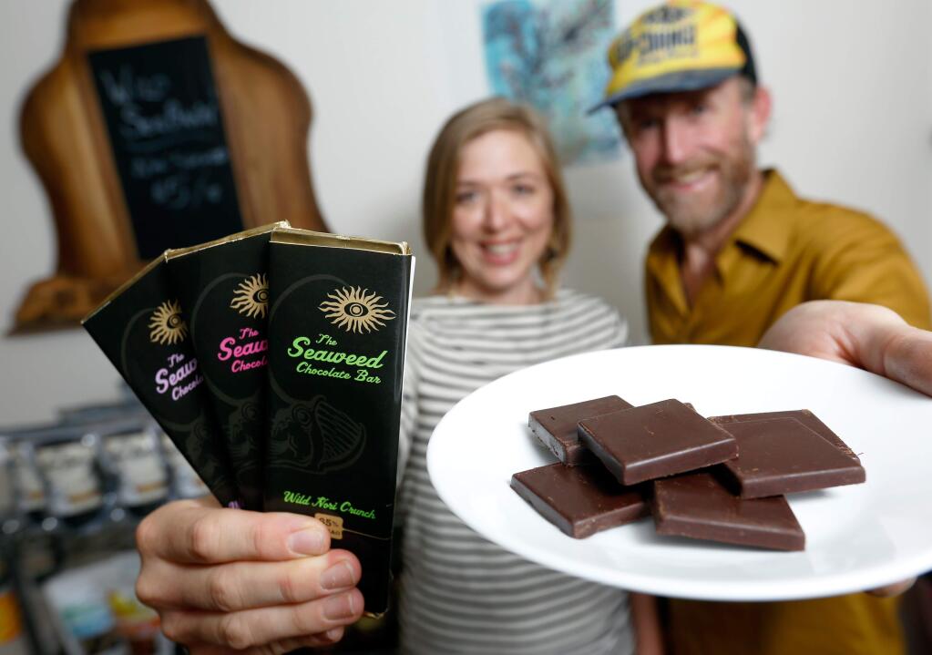 Courtney Smith, left, and Cole Meeker, owners of Sea of Change Trading Company, show their new seaweed chocolate bars at their office in Windsor, California on Wednesday, October 21, 2015. (Alvin Jornada / The Press Democrat)