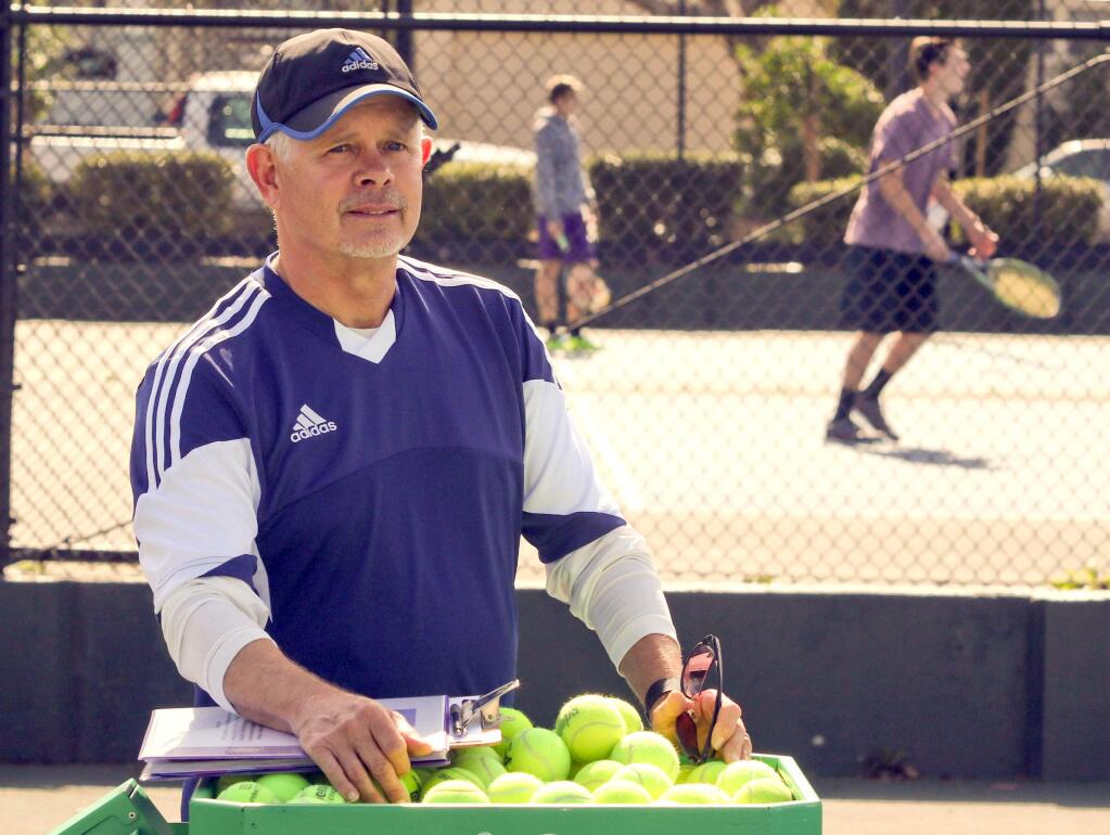 (SCOTT MANCHESTER/ARGUS-COURIER STAFF)Petaluma High School tennis coach Chris Home during a Trojan practice. Horne is leaving Petaluma High to become manager of the Marin Tennis Club.