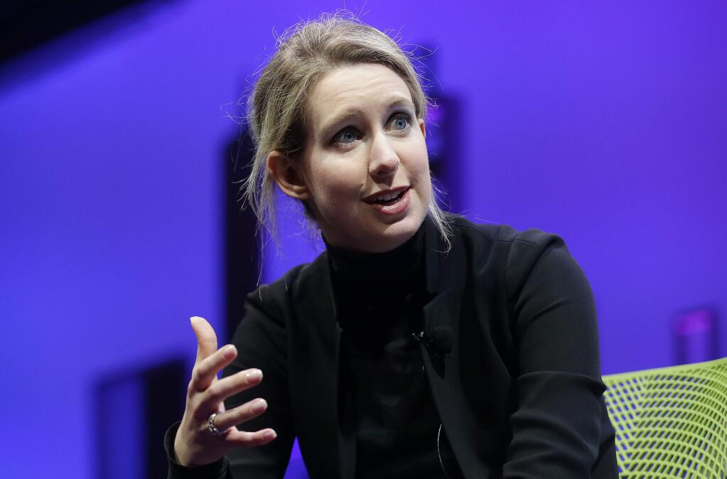 FILE - In this Nov. 2, 2015, file photo, Elizabeth Holmes, founder and CEO of Theranos, speaks at the Fortune Global Forum in San Francisco. Holmes announced Oct. 6, 2016, that Theranos will close its labs and wellness centers and lay off about 340 employees in Arizona, California and Pennsylvania. (AP Photo/Jeff Chiu, File)