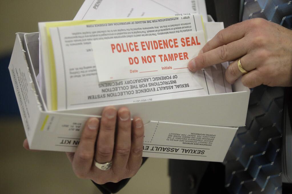 Utah State Crime Lab Director Jay Henry holds a sexual assault evidence collection kit. (RICK BOWNER / Associated Press)