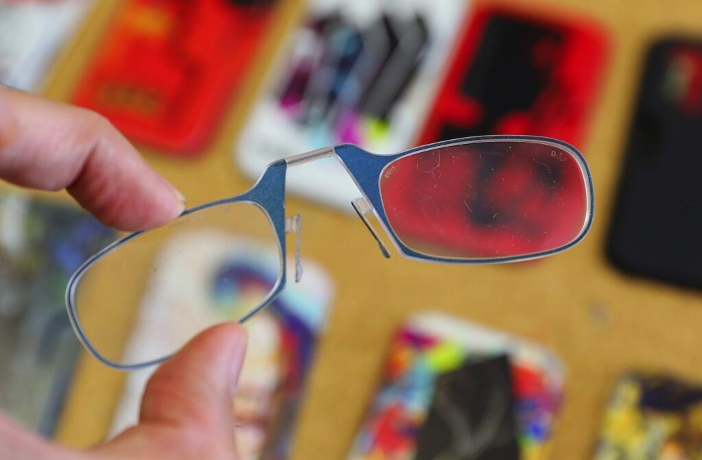 ThinOPTICS portable reading glasses are thin foldable glasses that can be kept in a small case, meant to be carried everywhere.(Christopher Chung/ The Press Democrat)