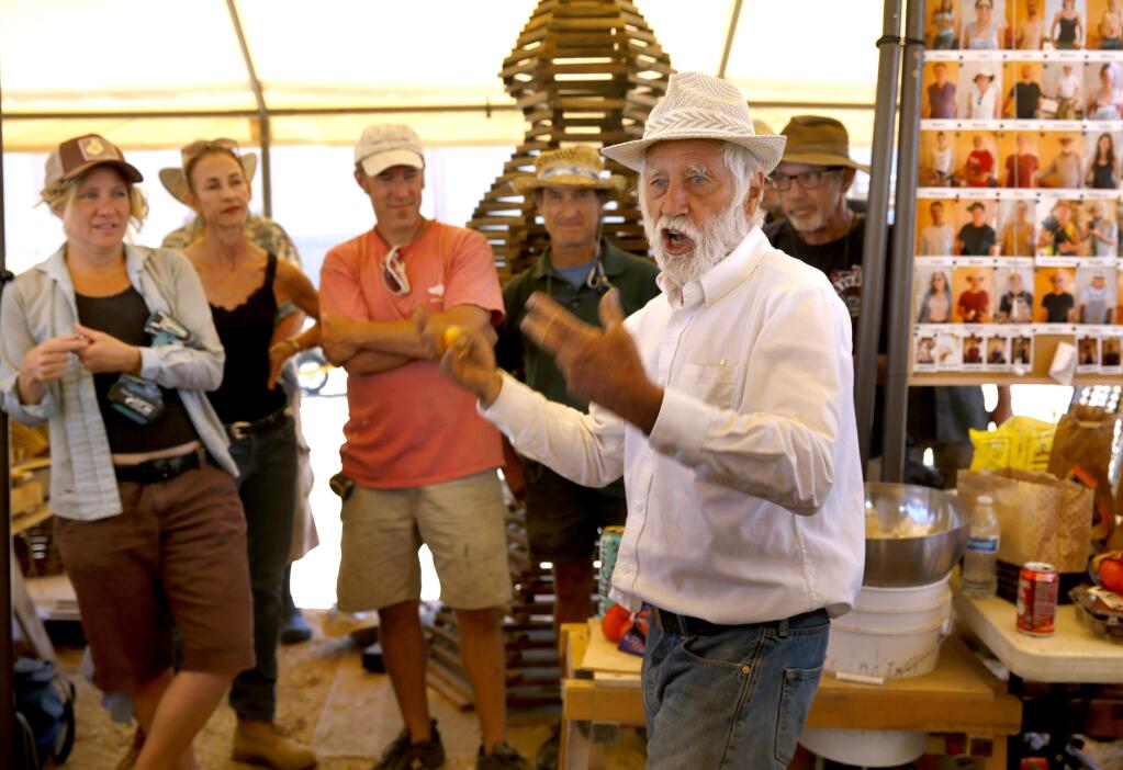 Artist David Best addresses a group of volunteers who have been working to construct a wooden temple that will be assembled at Burning Man. Photo taken on Saturday, July 30, 2016 in Petaluma, California . (BETH SCHLANKER/ The Press Democrat)