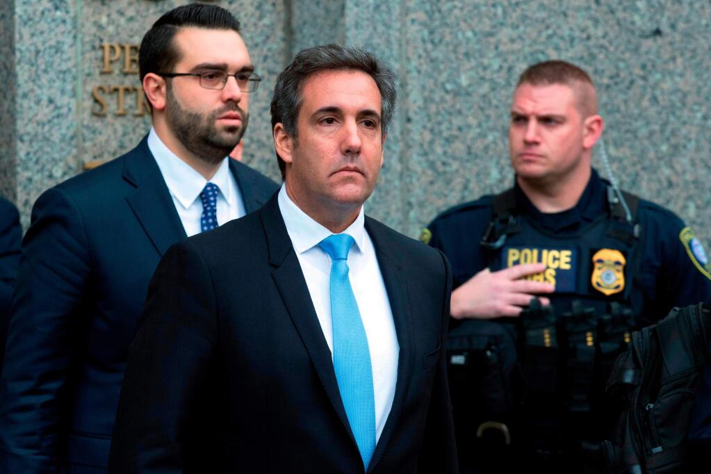 FILE - In a Monday, April 16, 2018, file photo, Michael Cohen, President Donald Trump's personal attorney, center, leaves federal court, in New York. Cohen filed papers in federal court in Los Angeles Wednesday, April 25, 2016, saying he will assert his Fifth Amendment rights, stating that he will exercise his constitutional right against self-incrimination in a lawsuit brought by porn actress Stormy Daniels, who said she had an affair with Trump. (AP Photo/Mary Altaffer, File)
