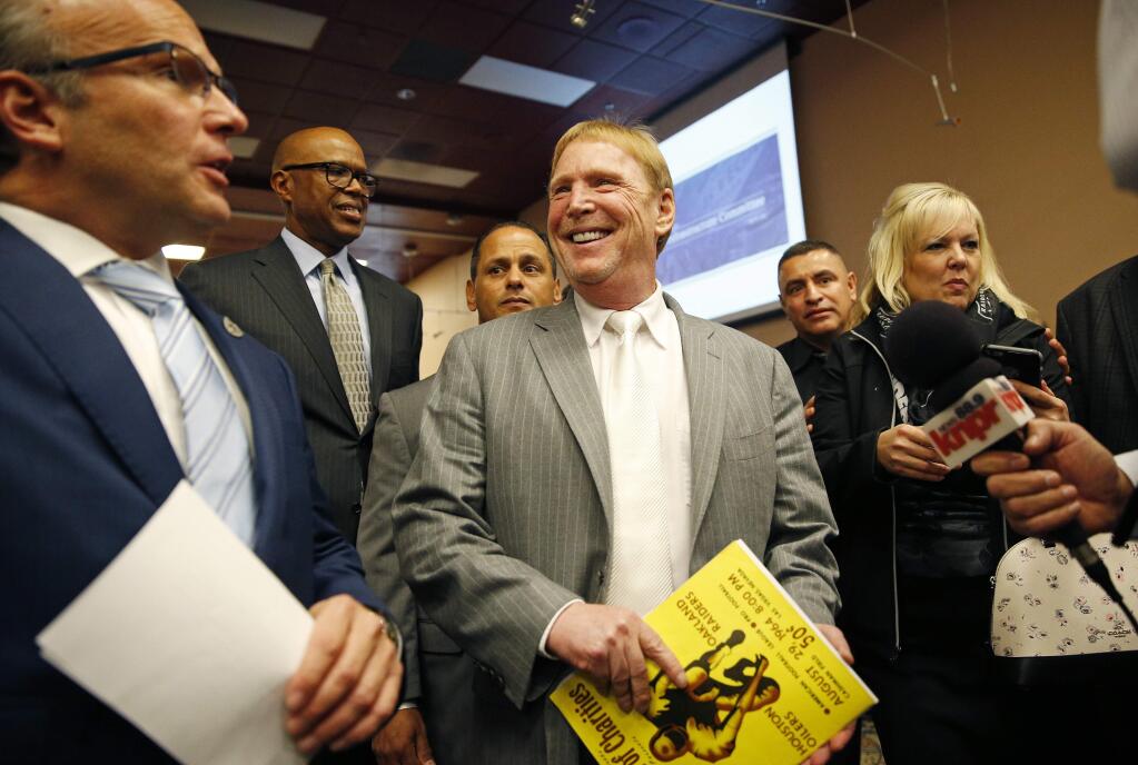 Oakland Raiders Owner Mark Davis smiles as he leaves a meeting of the Southern Nevada Tourism Infrastructure Committee, Thursday, April 28, 2016, in Las Vegas. Davis says he wants to move the team to Las Vegas and is willing to spend a half billion dollars as part of a deal for a new stadium in the city.(AP Photo/John Locher)