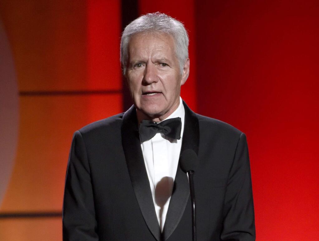 FILE - In this April 30, 2017, file photo, Alex Trebek speaks at the 44th annual Daytime Emmy Awards at the Pasadena Civic Center in Pasadena, Calif. The “Jeopardy!” host says his response to advanced pancreatic cancer treatment is “kind of mind-boggling” and his doctors say the 78-year-old is in “near remission.” Trebek tells People magazine he's responding very well to chemotherapy and the doctors have told him “they hadn't seen this kind of positive results in their memory.” Trebek says some of the tumors have shrunk by more than 50%. (Photo by Chris Pizzello/Invision/AP, File)