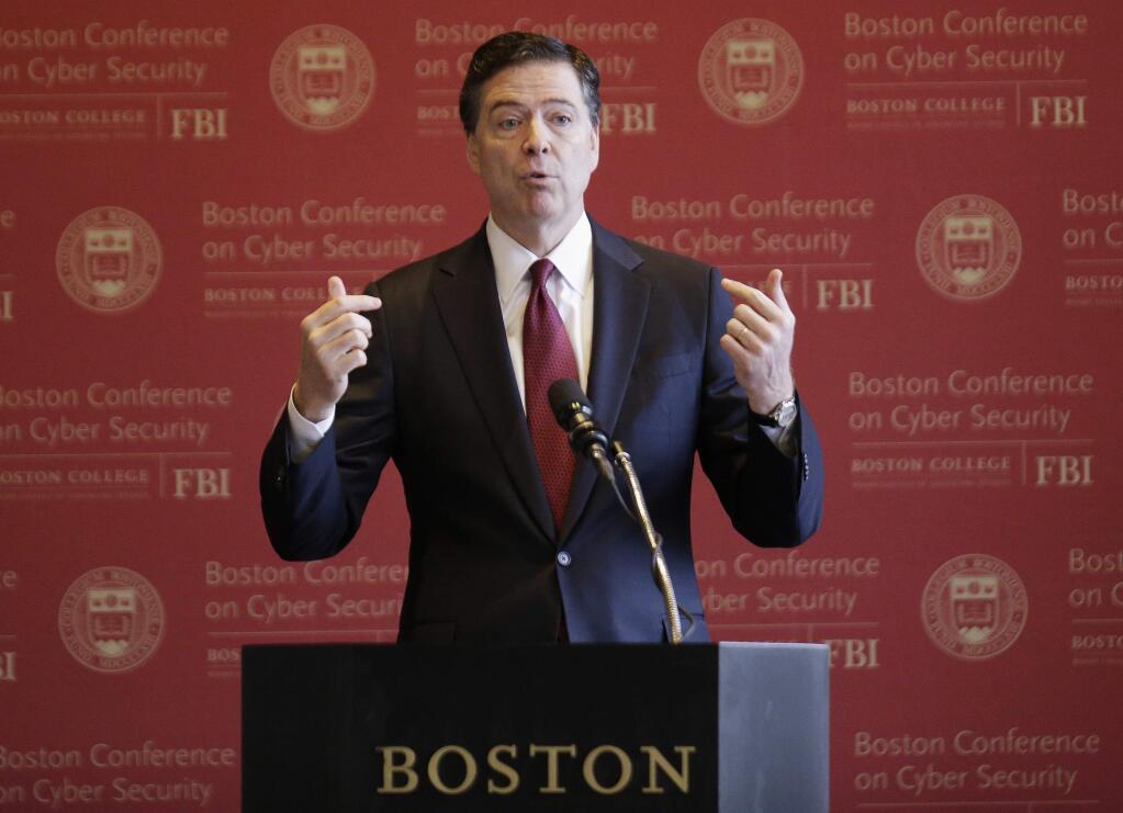 FILE - In this March 8, 2017 file photo, FBI Director James Comey speaks in Boston. The first public hearing in a congressional investigation into Russian interference in the presidential election opens with a hearing featuring FBI Director James Comey and the head of the National Security Agency. (AP Photo/Stephan Savoia, File)