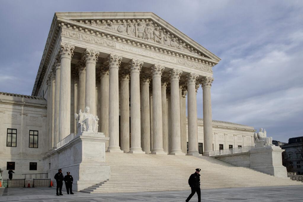 In this Feb. 14, 2017 photo, The Supreme Court is seen at day's end in Washington. The Supreme Court on Tuesday is hearing an appeal to a case involving a 2010 shooting of a Mexican boy by a U.S. Border Patrol Agent. (AP Photo/J. Scott Applewhite)