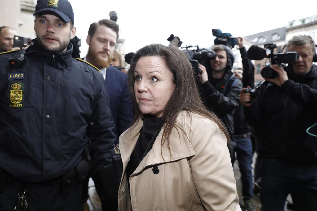 Defense attorney Betina Hald-Engmark arrives at the courthouse for the verdict in the case of Peter Madsen, in Copenhagen, Wednesday, April 25, 2018. Danish inventor Peter Madsen has been sentenced to life in prison for torturing and murdering Swedish journalist Kim Wall on his private submarine. Judge Anette Burkoe at the Copenhagen City Court said she and the two jurors agreed Wall's death was a murder, saying Madsen didn't given 'a trustworthy' explanation. (Nikolai Linares/Ritzau Scanpix via AP)