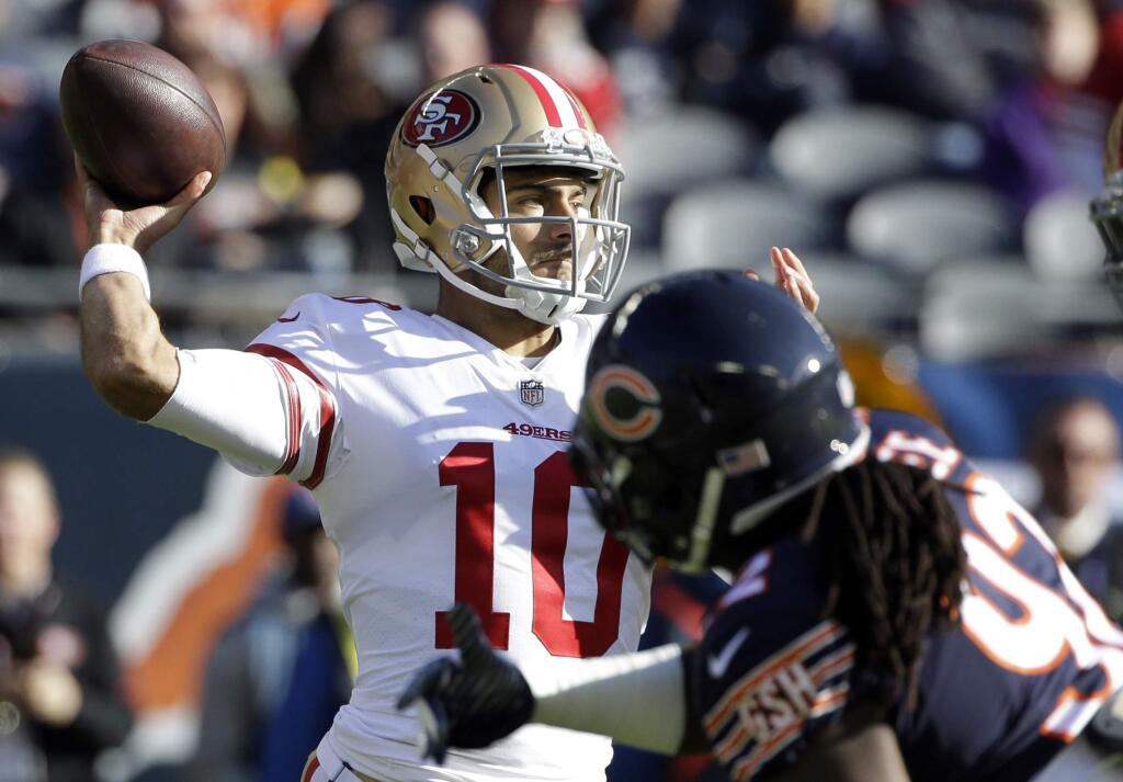 FILE - In this Sunday, Dec. 3, 2017, file photo, San Francisco 49ers quarterback Jimmy Garoppolo (10) throws a pass during the first half of an NFL football game against the Chicago Bears in Chicago. Garoppolo looks to follow up a successful first start for the 49ers with another this week against Houston. (AP Photo/Nam Y. Huh, File)