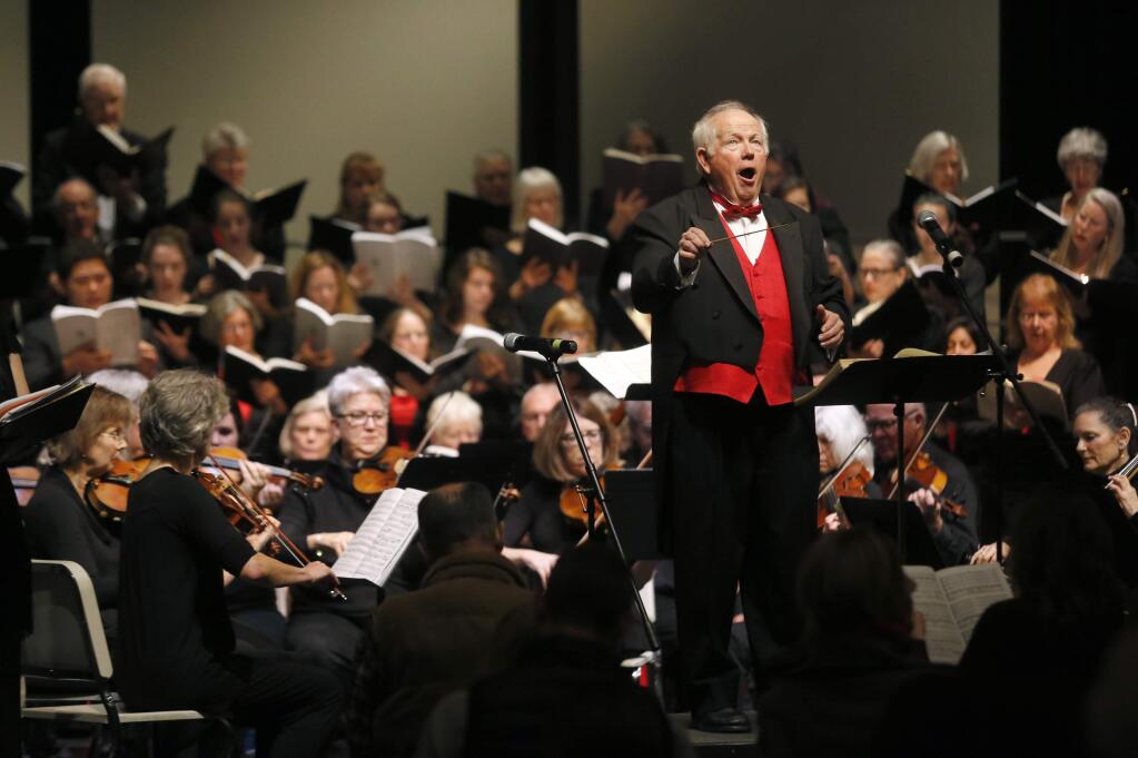 Daniel Earl leads concert goers and members of the Santa Rosa Symphonic Chorus, Santa Rosa Chamber Orchestra and SRJC Concert Choir and Chamber Singers during the 36th Annual Redwood Empire Sing-Along Messiah at Sonoma Country Day School on Sunday, December 18, 2016 in Santa Rosa, California . (BETH SCHLANKER/The Press Democrat)