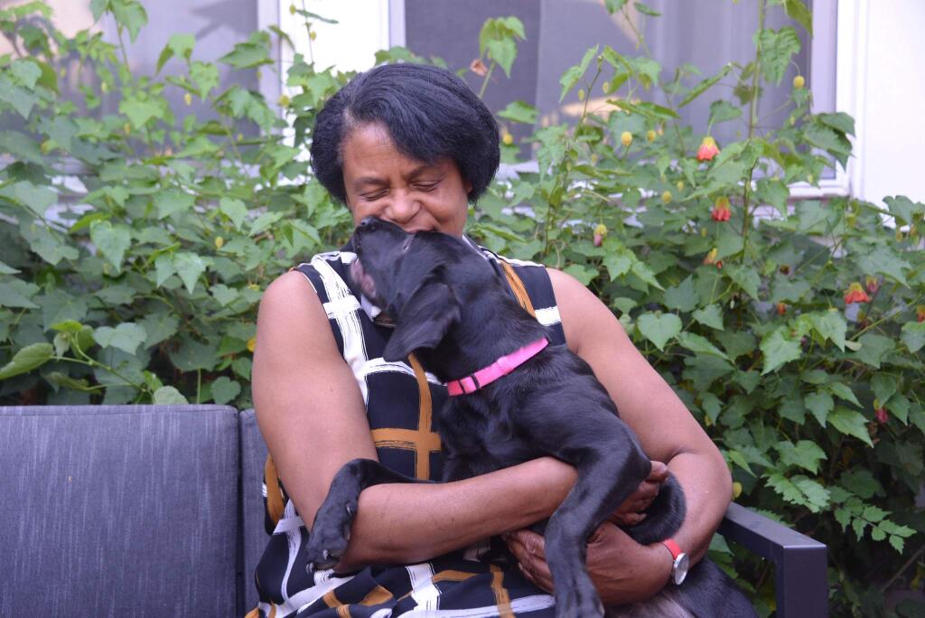 Late chef and Worth Our Weight cafe founder Evelyn Cheatham and her dog, Hurston. (Tessa Oliver)