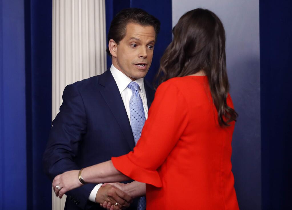 Sarah Huckabee Sanders who has been named White House Press Secretary shakes hands with incoming White House communications director Anthony Scaramucci during a press briefing in the Brady Press Briefing room of the White House in Washington, Friday, July 21, 2017. (AP Photo/Pablo Martinez Monsivais)