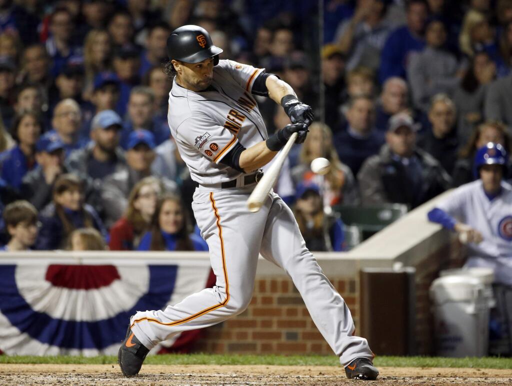 San Francisco Giants' Angel Pagan hits a double in the fourth inning of Game 1 of the National League Division Series against the Chicago Cubs, Friday, Oct. 7, 2016, in Chicago. (AP Photo/Nam Y. Huh)