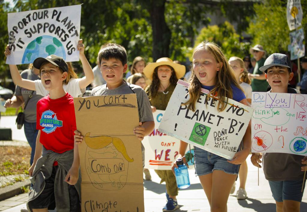 Petaluma students participated in a worldwide 'climate strike' movement by walking out of school and marching through the streets to bring attention to climate change Sept. 20, 2019. The city recently earned a $1 million grant to help address the climate emergency. (CRISSY PASCUAL/ARGUS-COURIER STAFF)