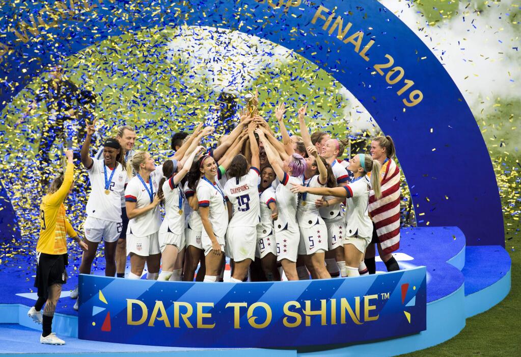 The U.S. Women's National Team celebrates their victory Sunday in the Women's World Cup final in Lyon, France. (PETE KIEHART / New York Times)
