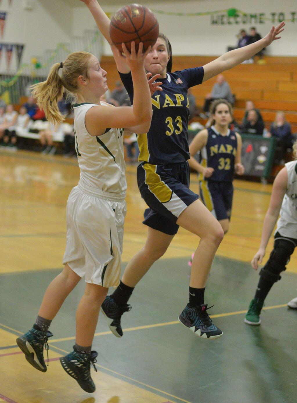 SUMNER FOWLER/FOR THE ARGUS-COURIERCasa Grande's Trinity Merwin shoots over the out-stretched arms of Napa defender Siena Young.