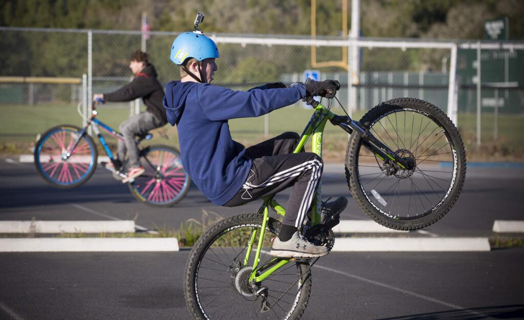Sonome Bike Life rider pops a wheelie. (Photo by Robbi Pengelly)
