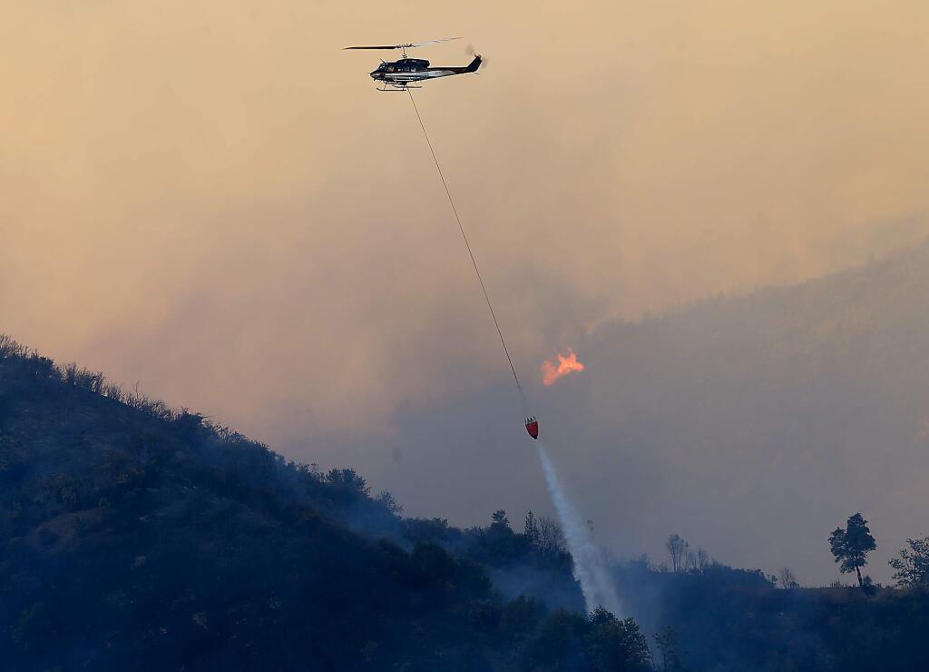 Helicopters were used to douse hot spots on the Elk fire, Wednesday Sept. 2, 2015 in Upper Lake. (Kent Porter / Press Democrat) 2015