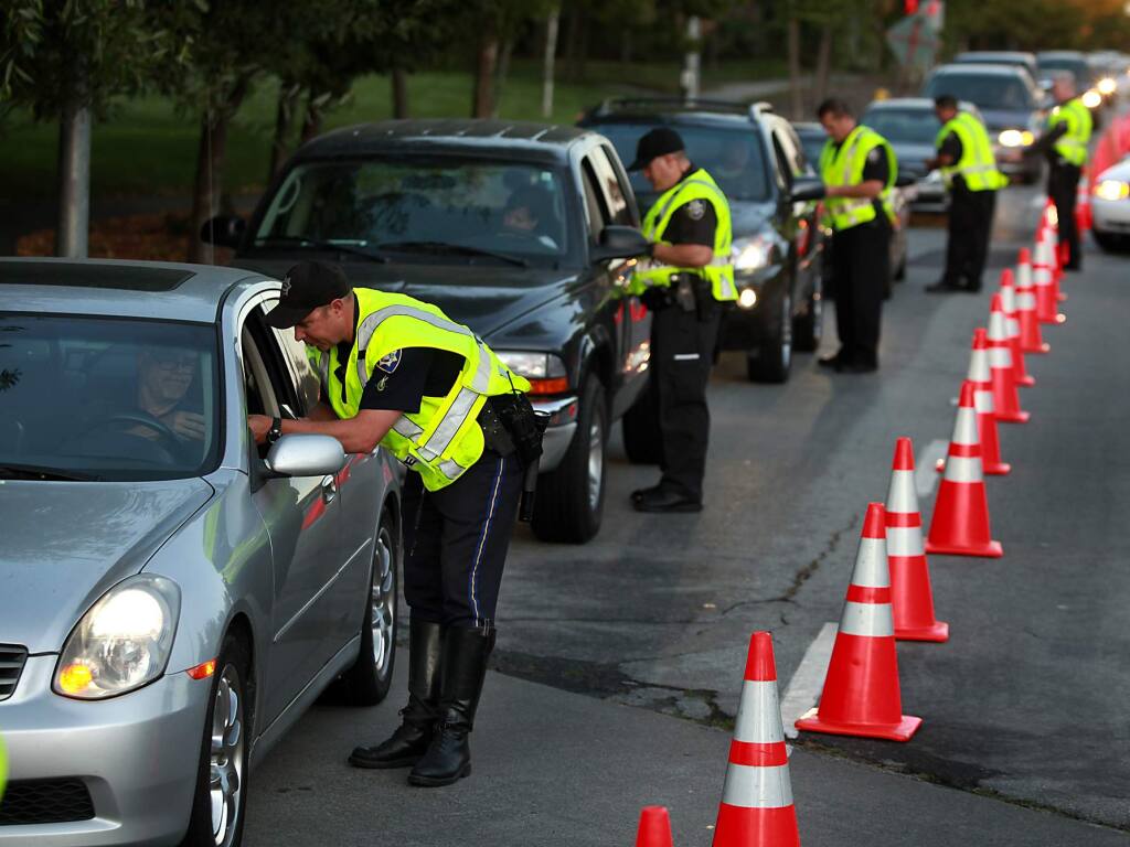 (File photo) Petaluma police officers conduct a DUI checkpoint on Sonoma Mountain Parkway, Friday Sept. 16, 2011, in Petaluma. (Kent Porter / Press Democrat file)
