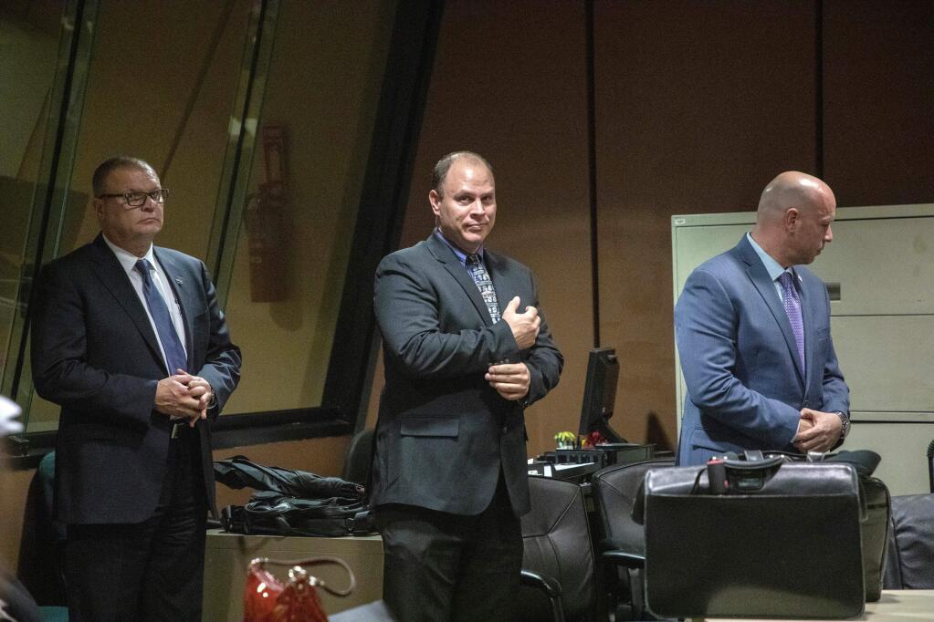 FILE - In this Oct. 30, 2018 file photo, from left, former Detective David March, Chicago Police Officer Thomas Gaffney and former officer Joseph Walsh appear at a pre-trial hearing in Chicago. The three Chicago police officers are accused of participating in a cover-up of the fatal shooting of Laquan McDonald. More than three years after the stunning video of the Chicago police shooting of McDonald was made public, one judge on Thursday, Jan. 17, 2019 is scheduled to announce how long the officer who pulled the trigger 16 times will be imprisoned and another will say if she believes three other officers lied about what happened to protect him. (Zbigniew Bzdak/Chicago Tribune via AP, Pool File)