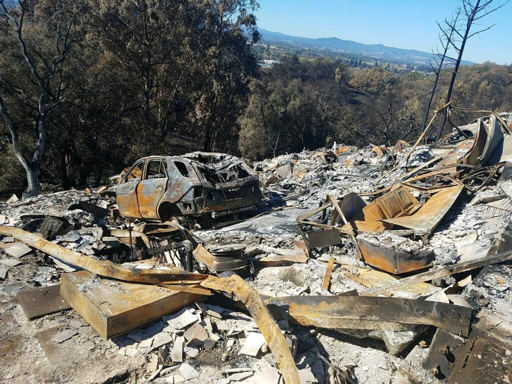 The charred shell of a Mercedes-Benz sits where the Fountaingrove home belonging to former Raiders receiver Cliff Branch burned in the first night of the Tubbs Fire. (Photo by Victoria Summers-Ligotti)