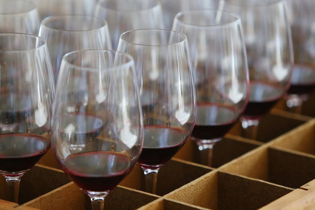 Glasses of merlot are ready to be brought in for judging for the Harvest Fair at the Sonoma County Fairgrounds in Santa Rosa on Tuesday, Sept. 18, 2018. (CHRISTOPHER CHUNG/ PD)