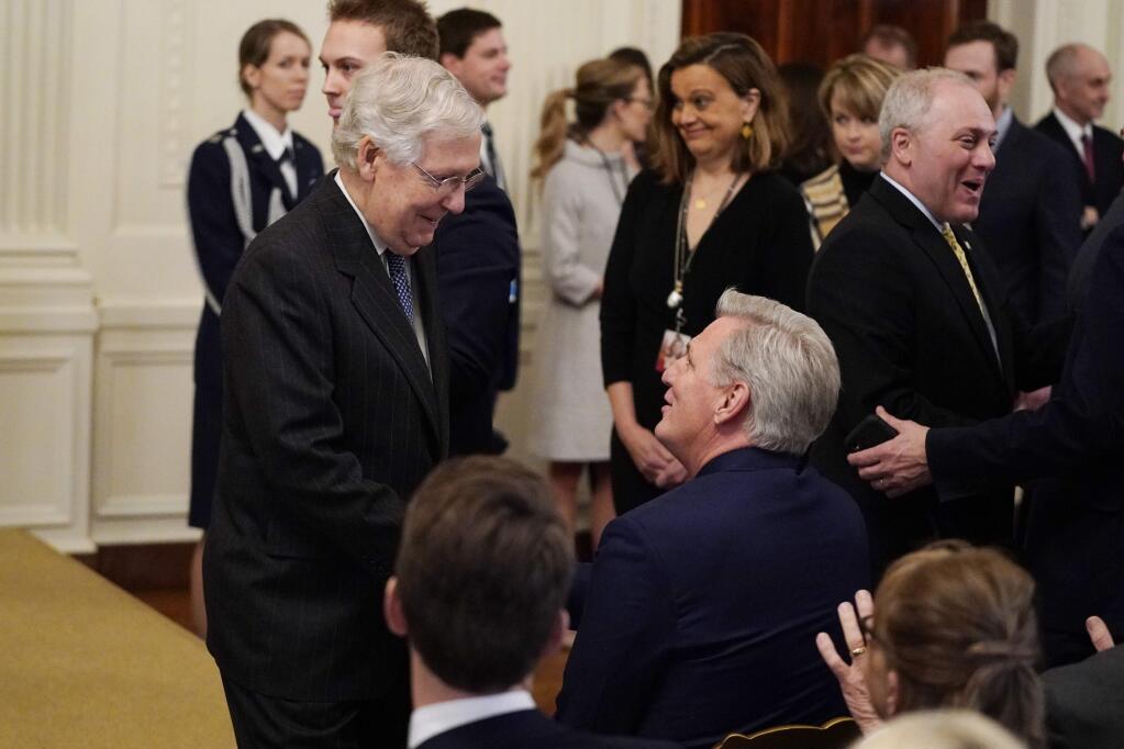 Senate Majority Leader Mitch McConnell, R-Ky., left, talks with House Minority Leader Kevin McCarthy of Calif., as they arrive to hear President Donald Trump speak in the East Room of the White House, Thursday, Feb. 6, 2020, in Washington. (AP Photo/ Evan Vucci)