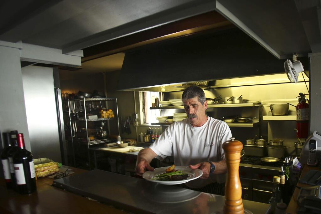 Chef Corey Basso, formerly of Le Bistro (pictured here in 2014) brought his culinary skills, and popular halibut, back to Seared this year. (Conner Jay/The Press Democrat)