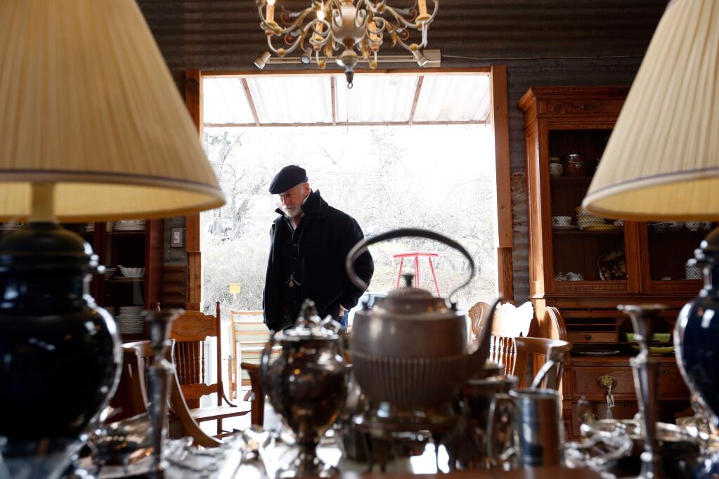 Photos by Alvin Jornada / The Press DemocratRobert Clink of Revelation, a lighting and home design store in Mill Valley, looks over the selection of furniture at Farmer's Wife Barntique in Cotati. The once-a-month antiques sale held in a barn is full of vintage treasures sold to benefit Petaluma's homeless animals.